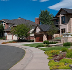 suburban homes under a blue sky