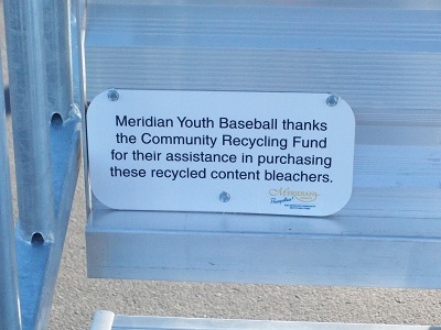 sign attached to bleachers indicating they were purchased with assistance from MCRF