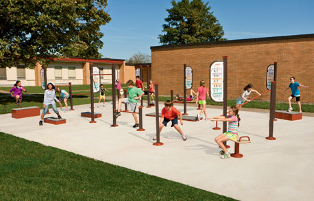 Children playing on exercise equipment at Hillsdale Park