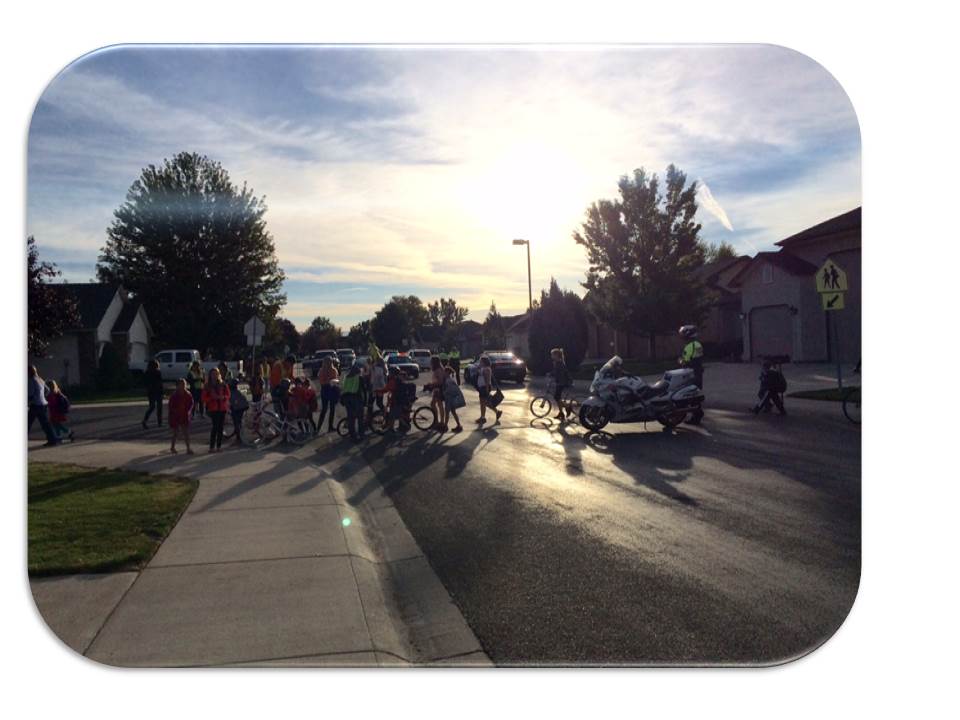 Police in a neighborhood with a crowd of children