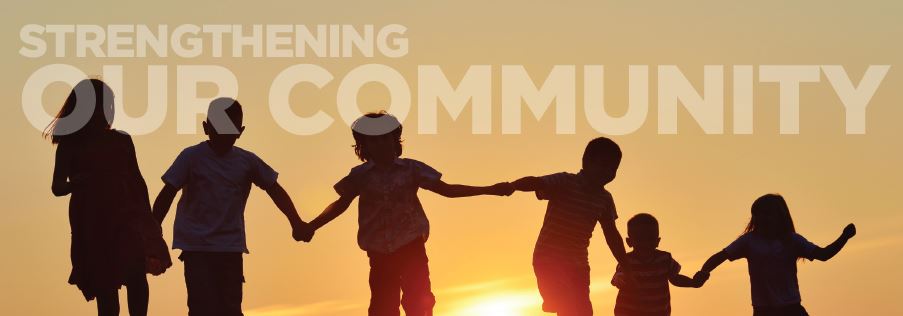 sunset photo with silhouettes of children holding hands. Text overlay: Strengthening our Community